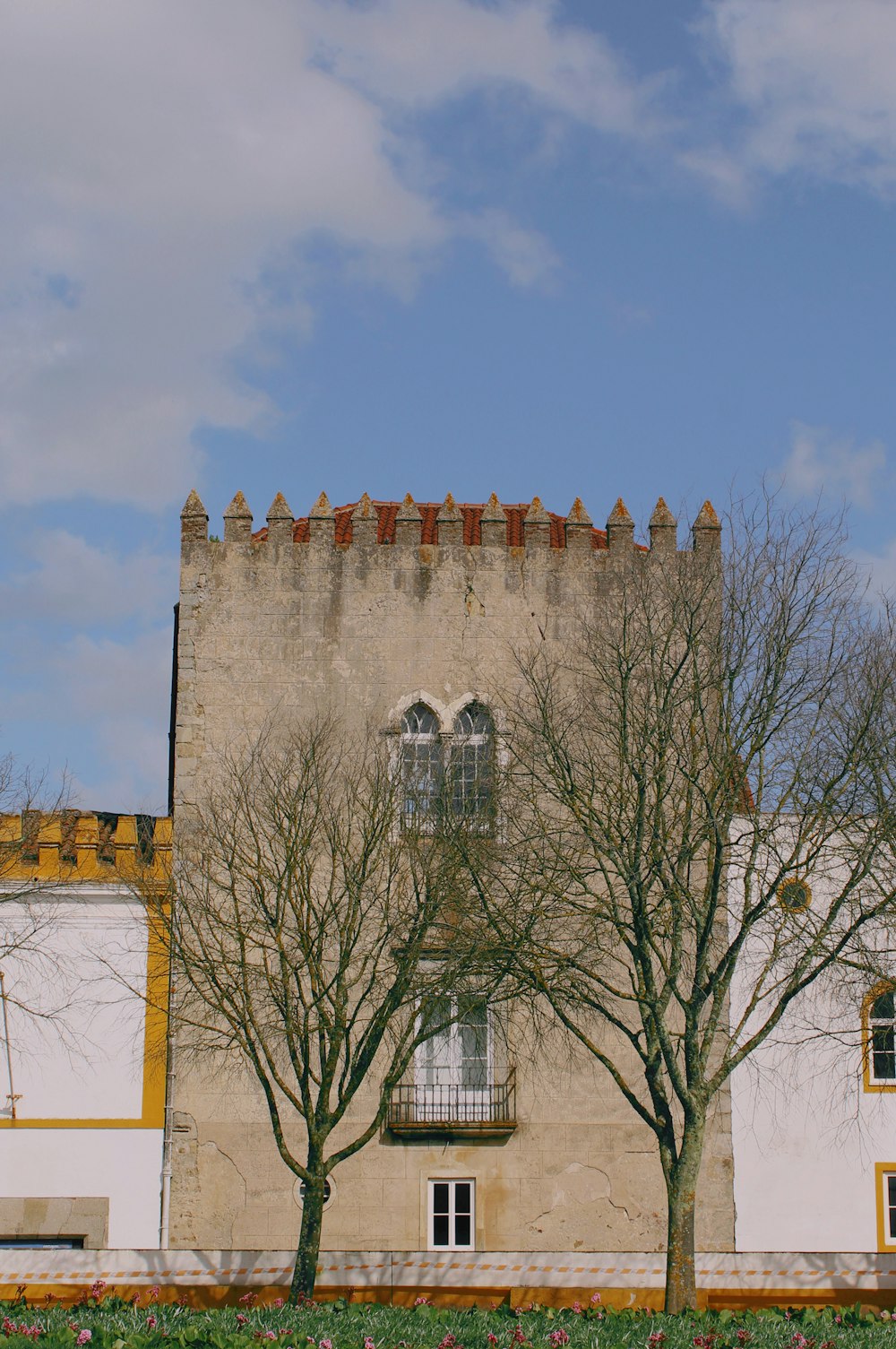 brown concrete building under blue sky during daytime