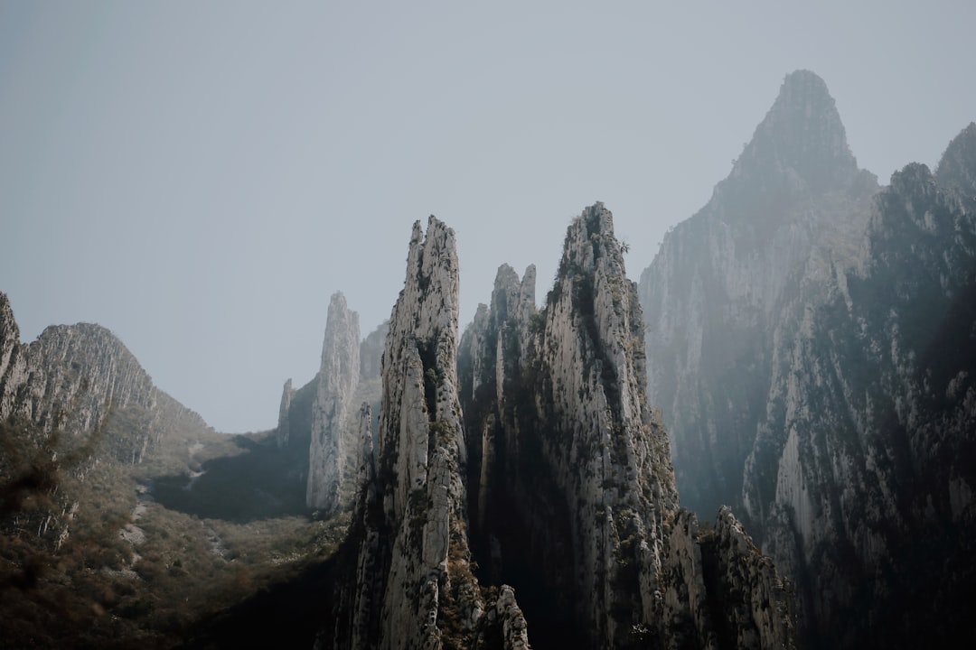 brown rocky mountain under white sky during daytime