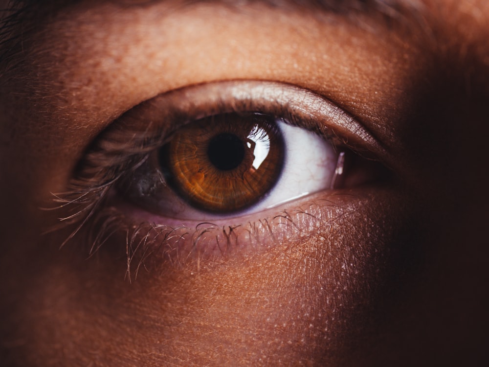 persons eye in close up photography