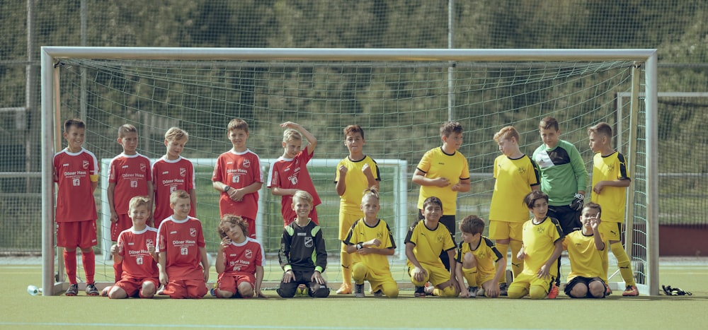 group of men in red soccer jersey