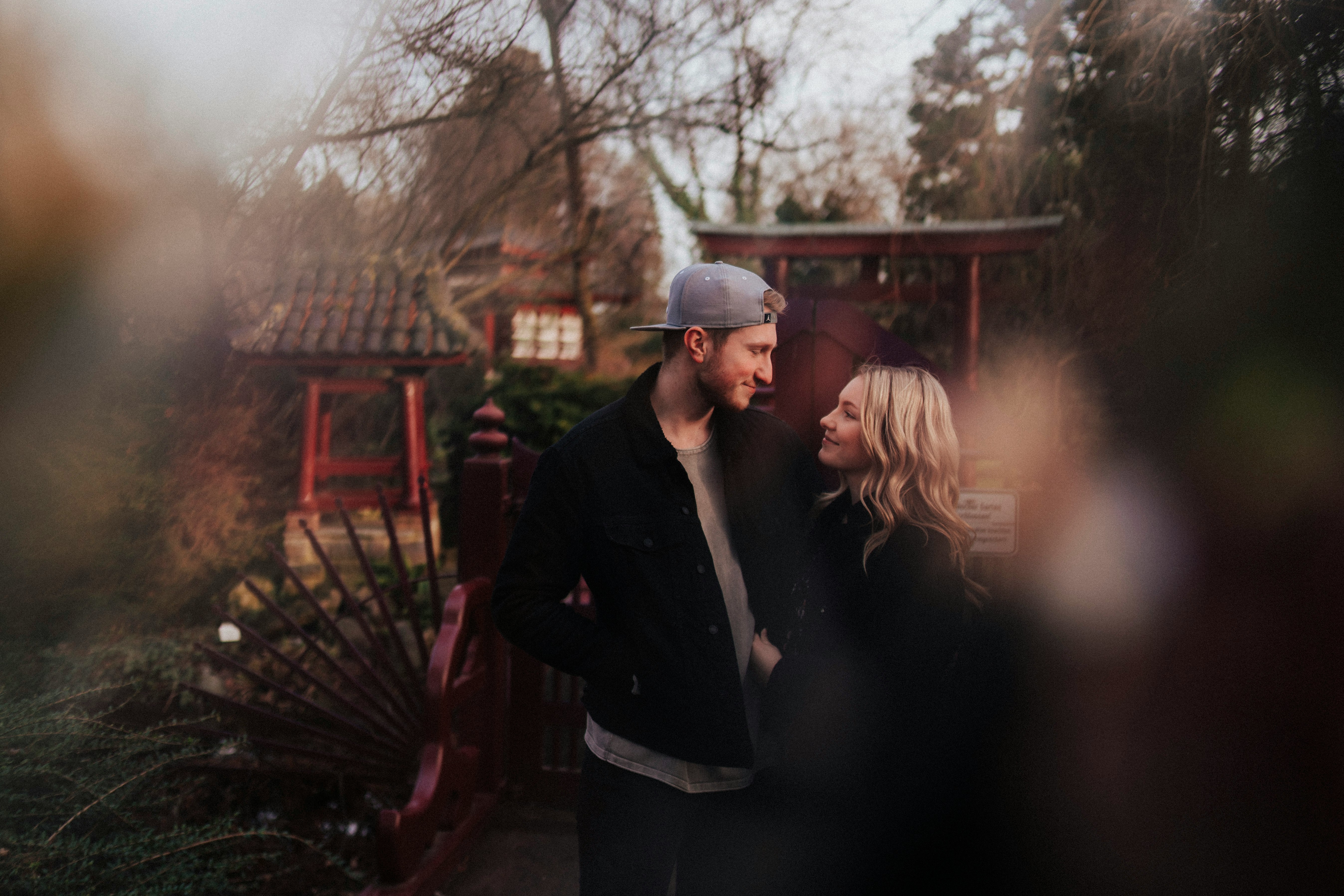 man in black jacket standing beside woman in black jacket