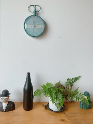 Vintage decor details including an old clock and framed black-and-white photos.