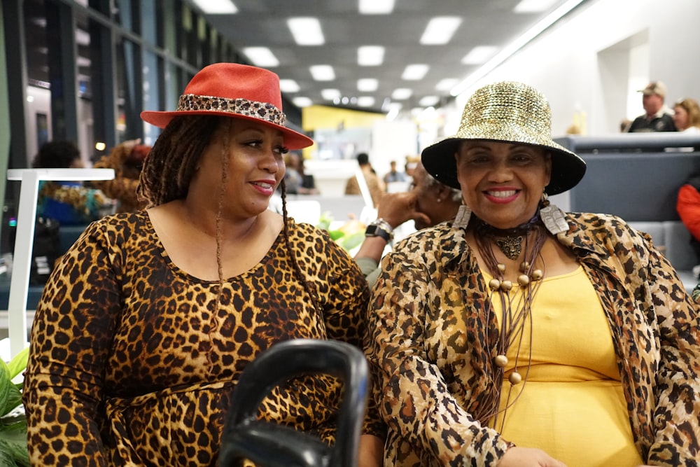 woman in brown and black leopard print shirt wearing red hat