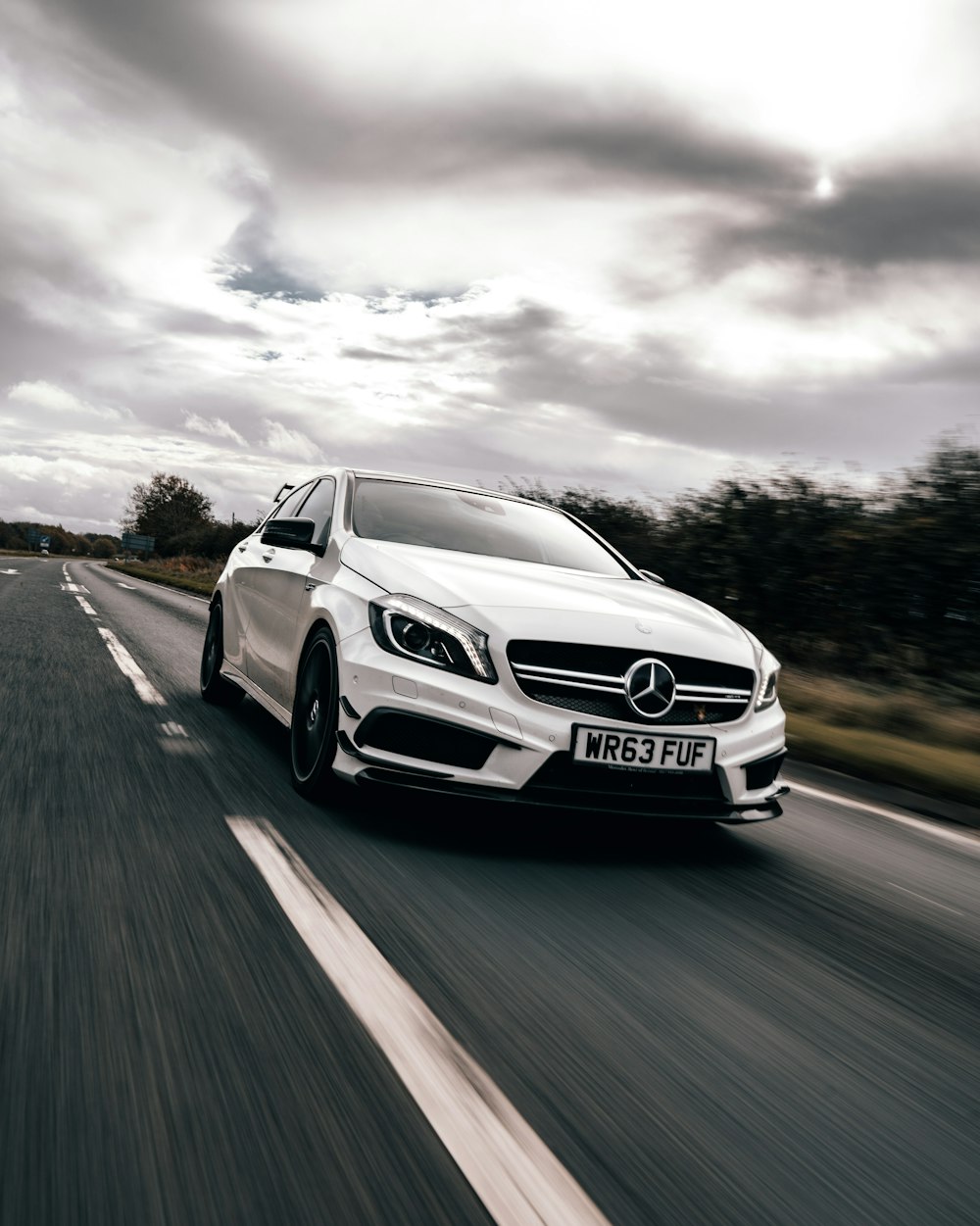 white mercedes benz car on road