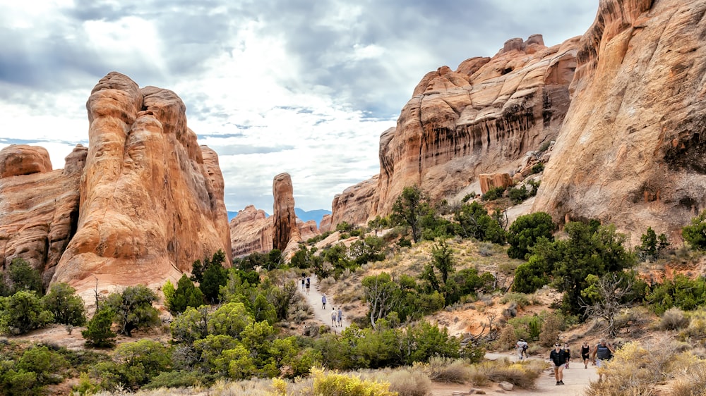 brown rock formation under white clouds during daytime