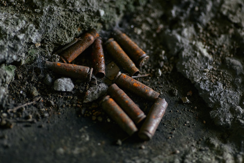 brown cigarette butts on black surface