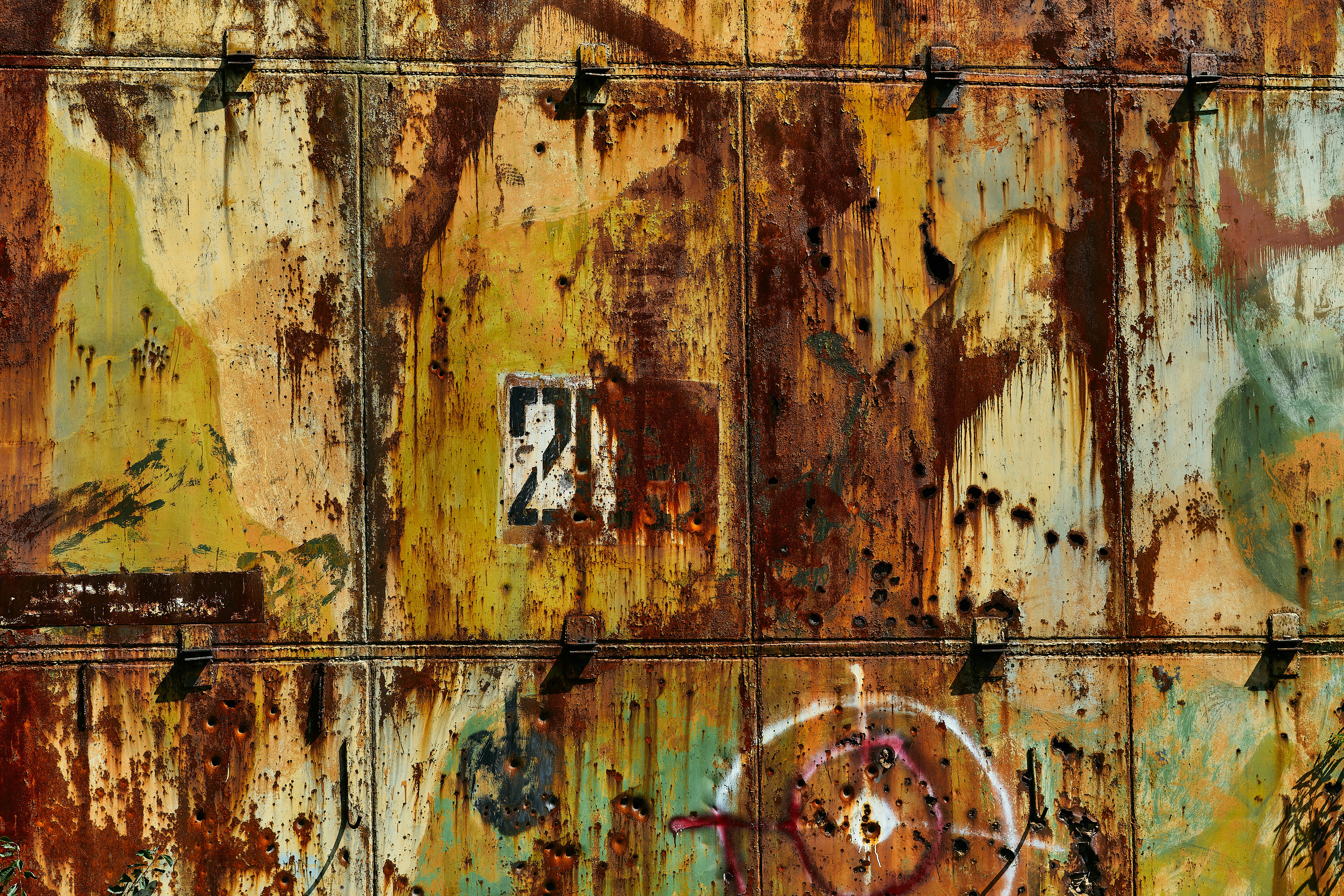 Messy horizontal grunge metal background for websites, design, photoshop and social media. Horizontal metal wall with rust, scratches, gunshot marks, hunting target, number 203, splashes of orange, yellow, white and green paint