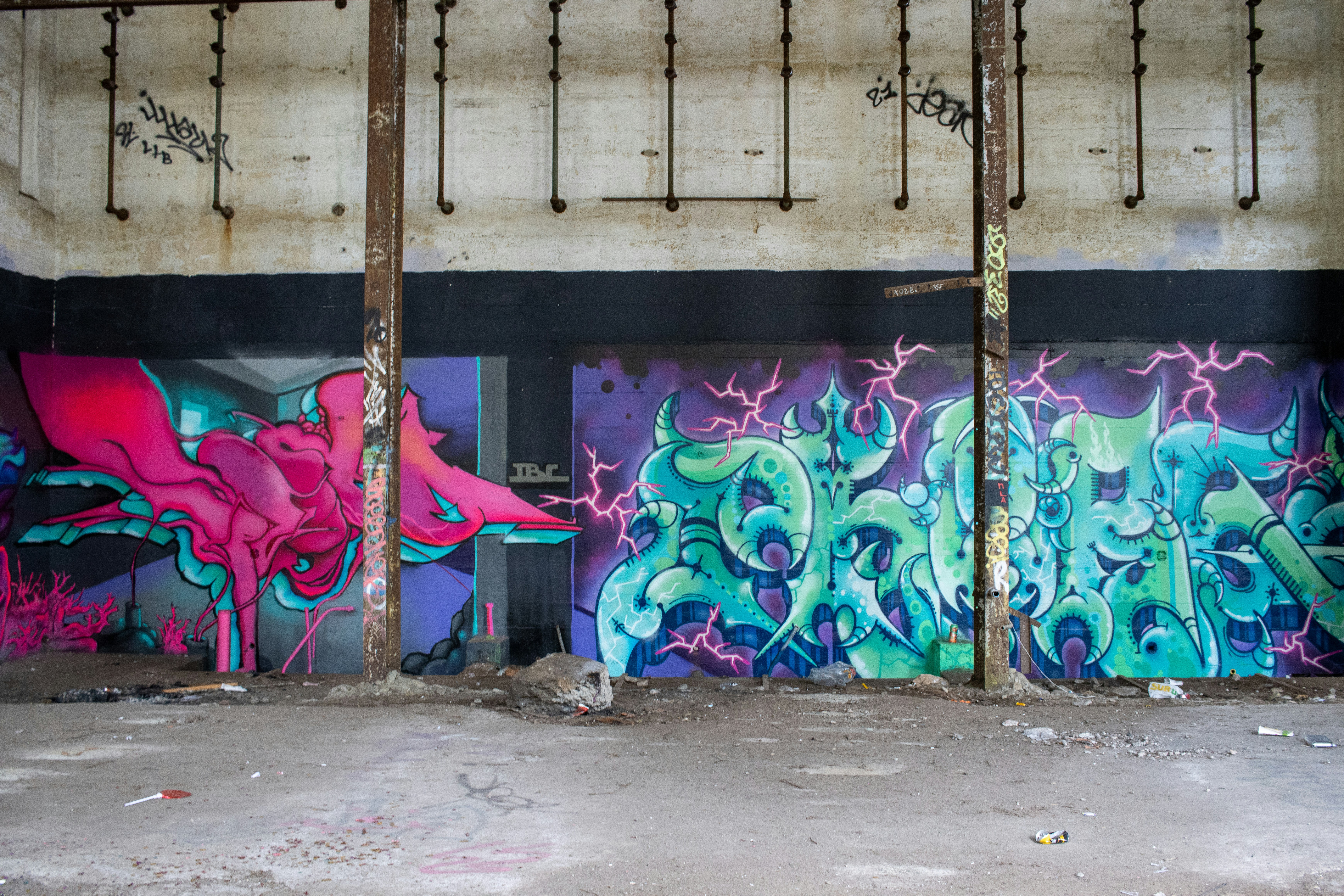 purple and blue graffiti on wall