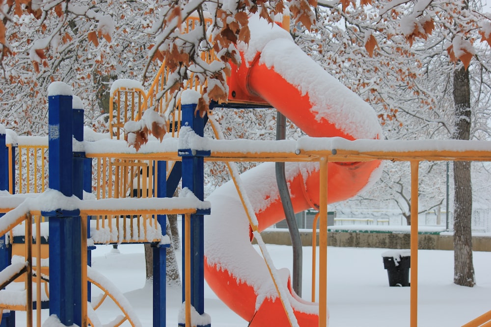 blue metal railings covered with snow