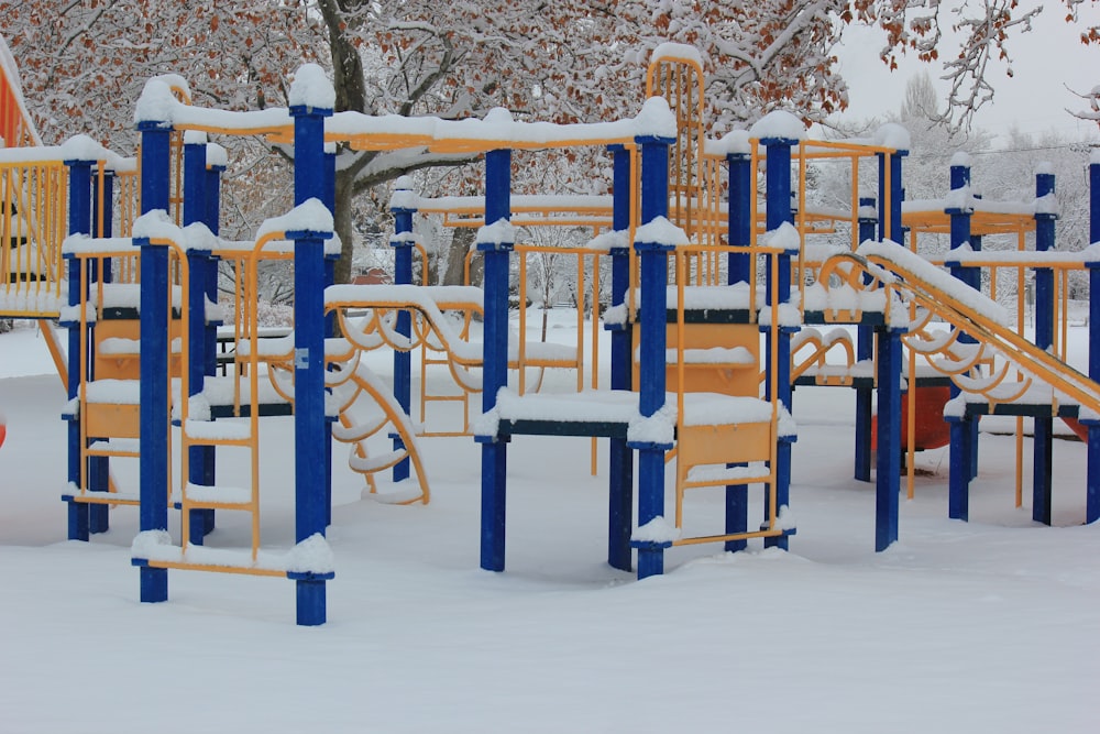 brown wooden chairs on snow covered ground