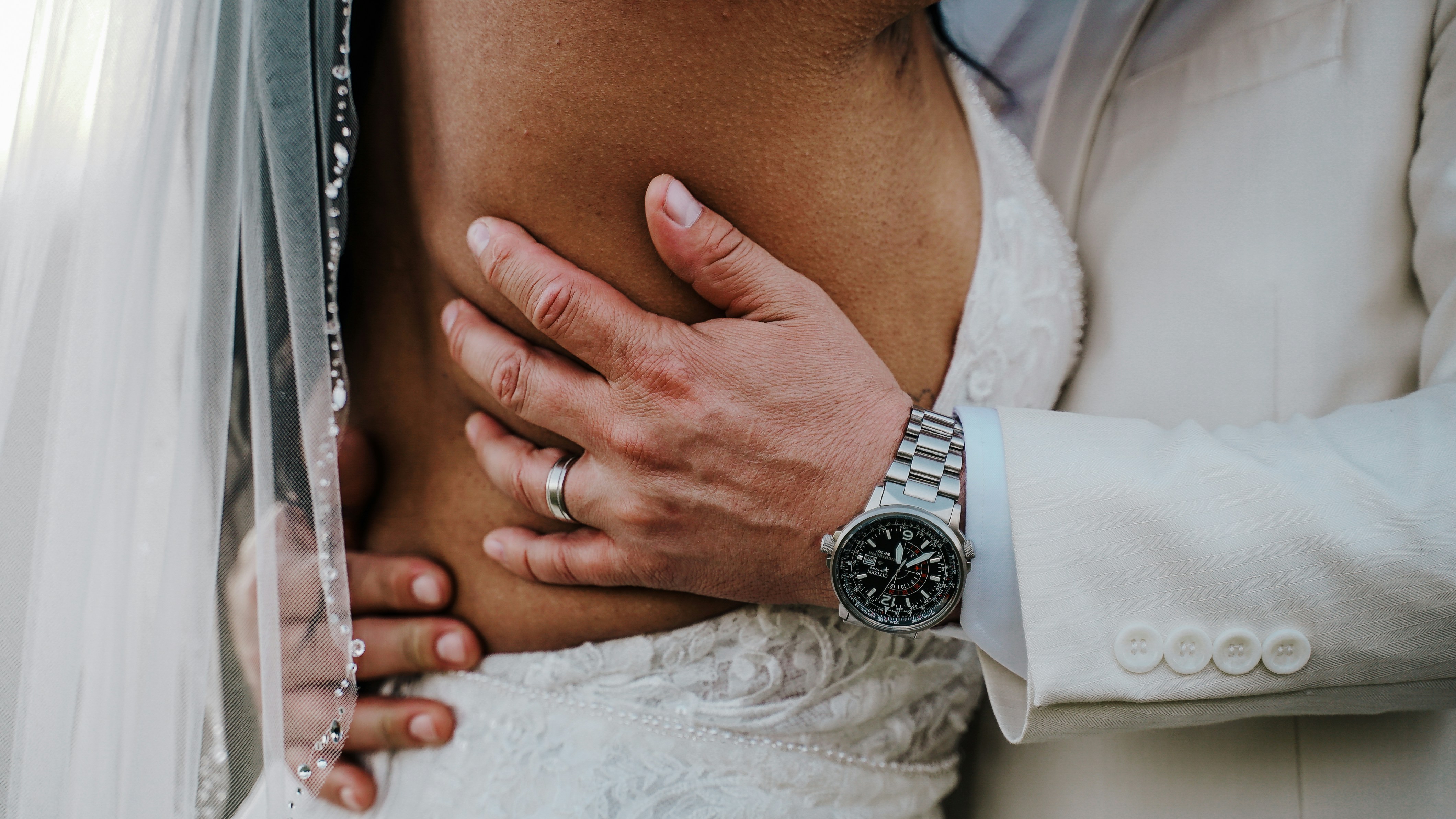 person wearing silver and white analog watch