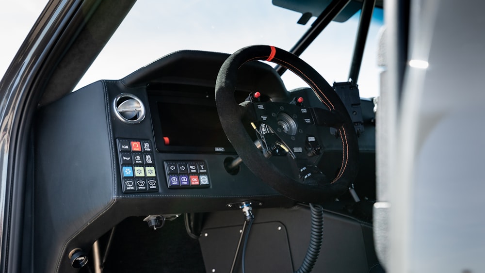 black and gray car steering wheel