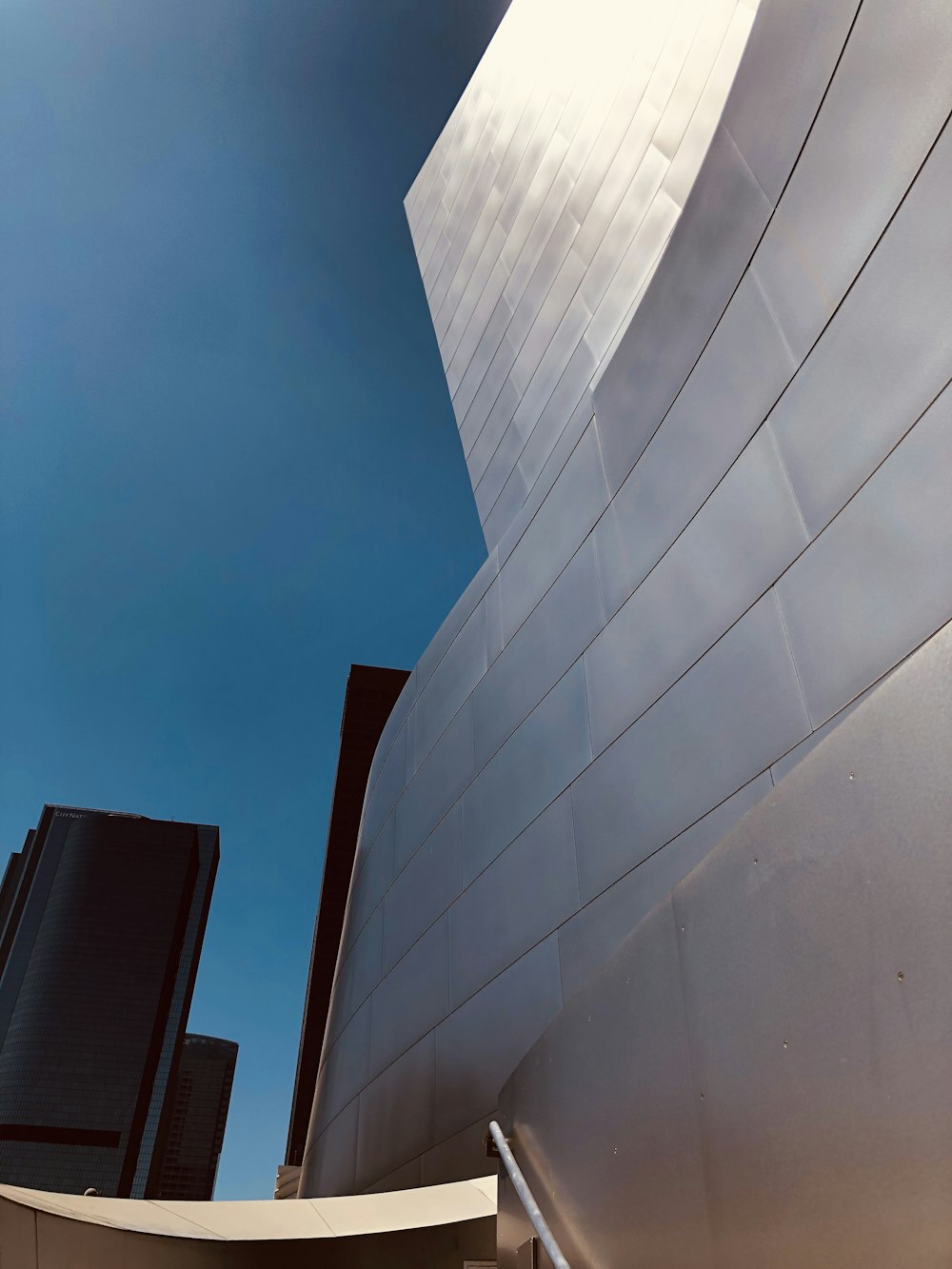 white concrete building under blue sky during daytime