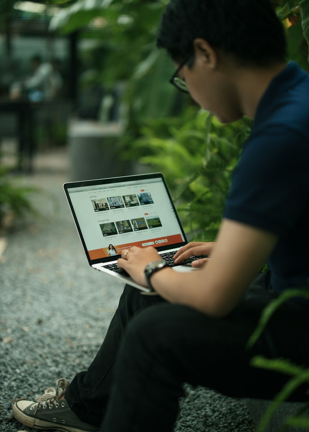 boy in blue t-shirt using white tablet computer