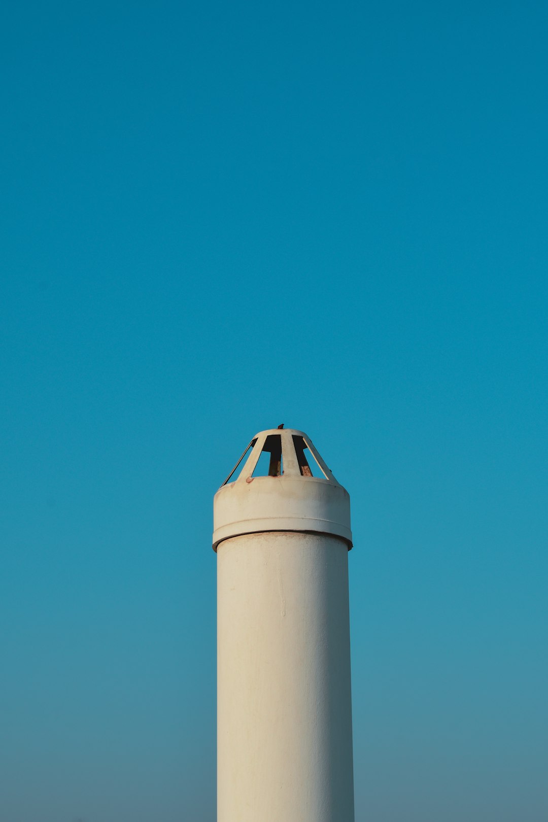white and brown concrete tower under blue sky during daytime