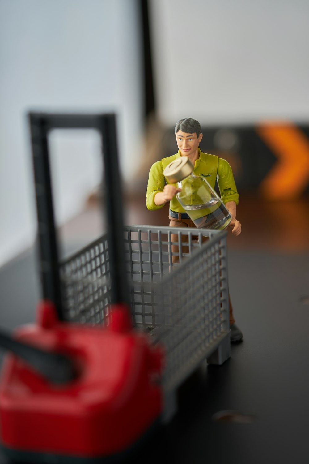 man in green polo shirt and black pants in shopping cart