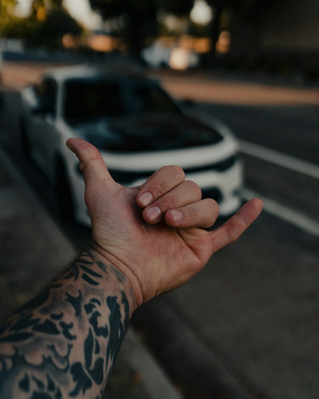 person with tattoo on left hand