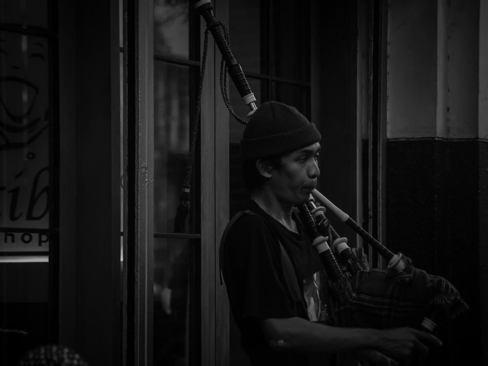 man in black shirt playing trumpet