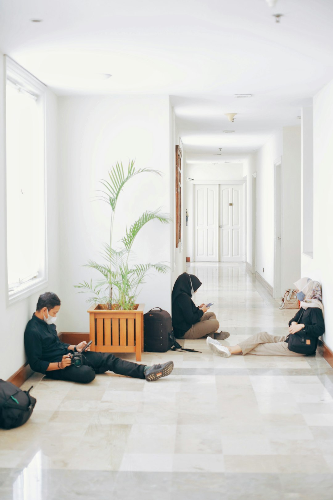 people sitting on floor inside room