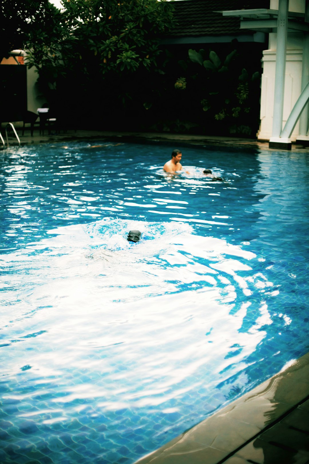 woman in swimming pool during daytime