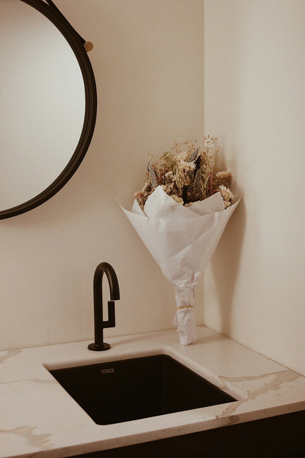 white tissue paper on black ceramic sink