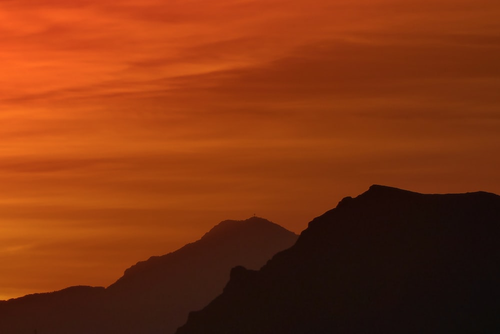 silhouette of mountains during sunset