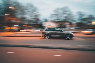 black suv on road during daytime