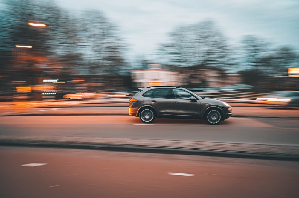 black suv on road during daytime