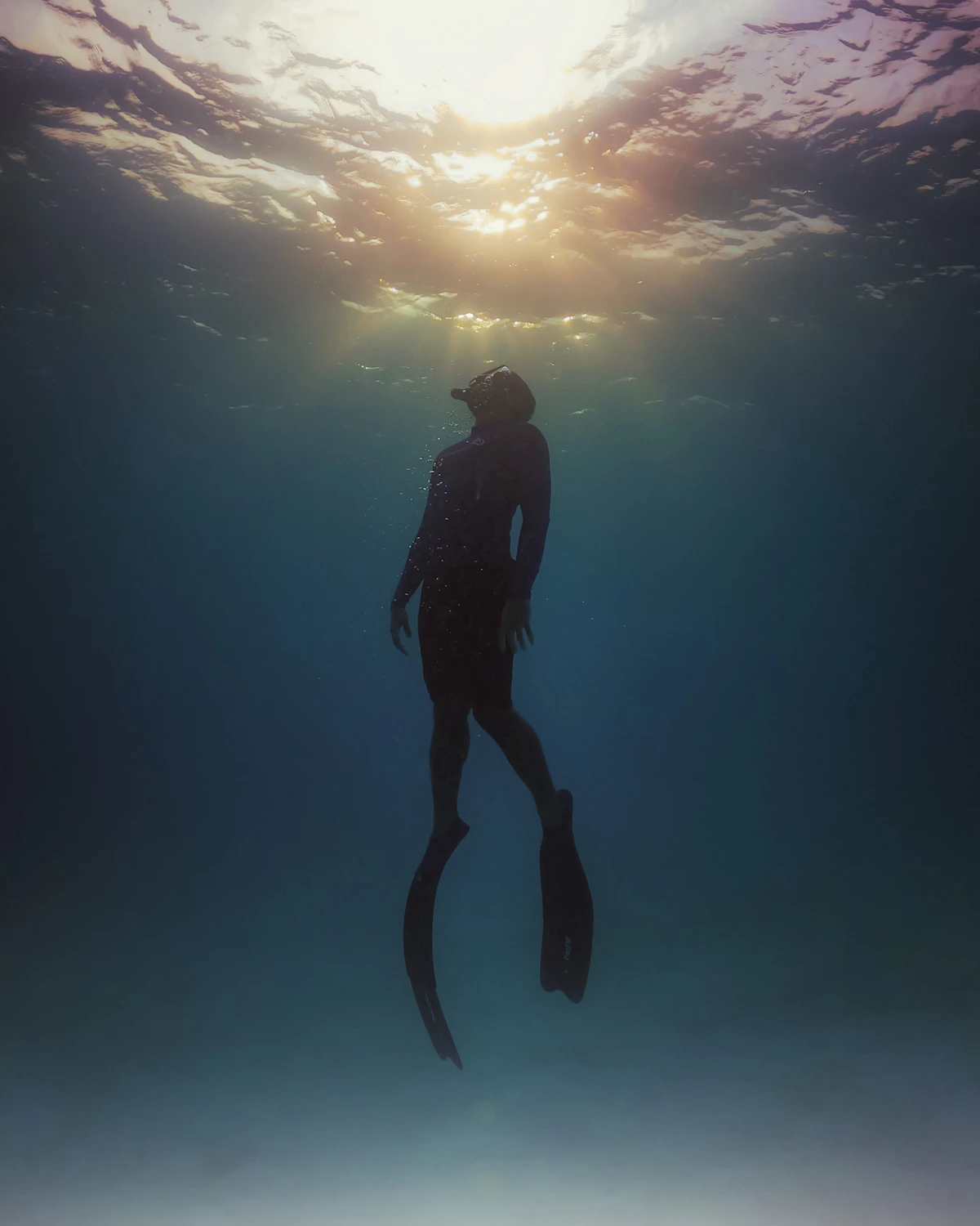 Diver relaxing at the surface between dives