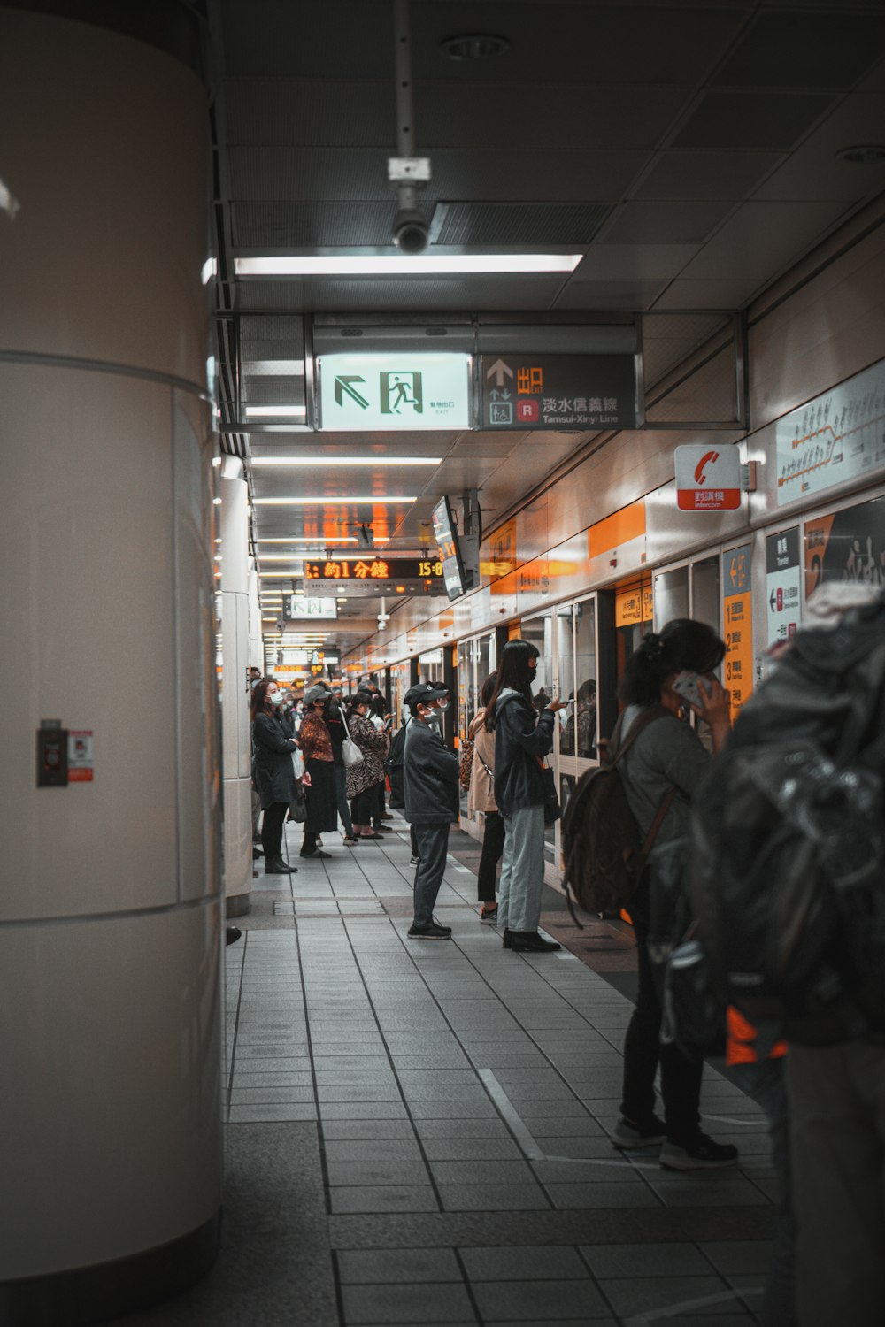 people walking on sidewalk during nighttime