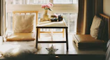 Cozy seating area with a small wooden table and chairs perfect for morning tea.