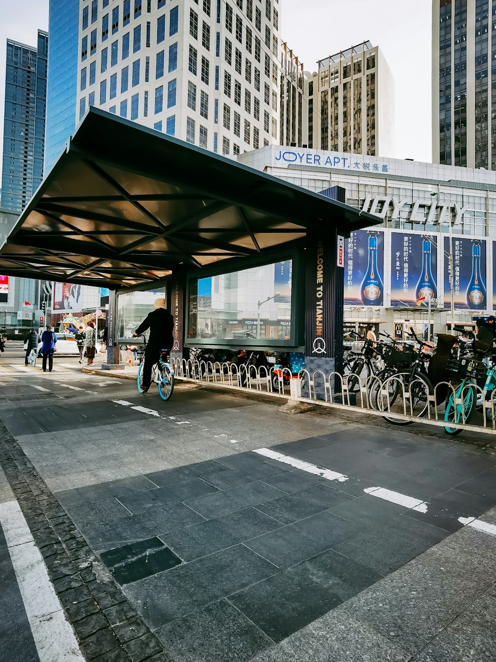 people walking on sidewalk near building during daytime