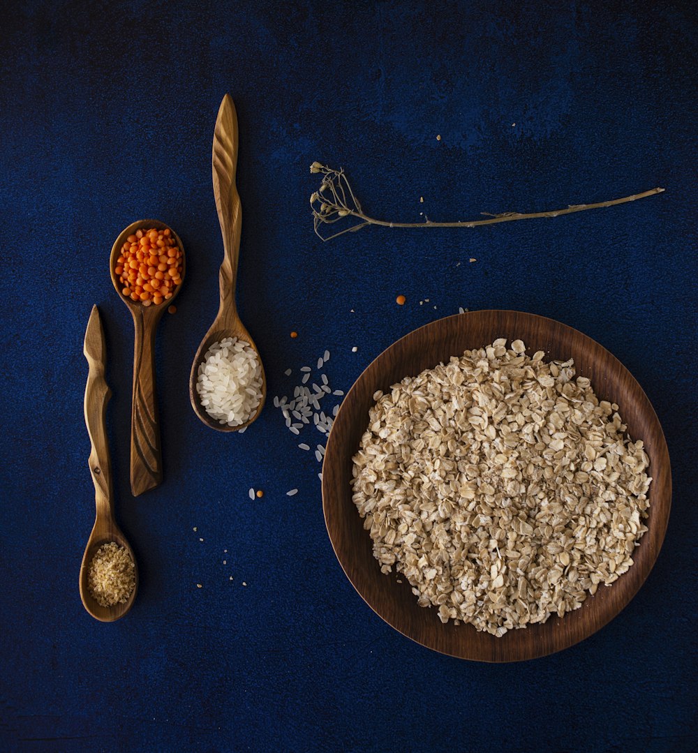 brown wooden spoon on blue textile