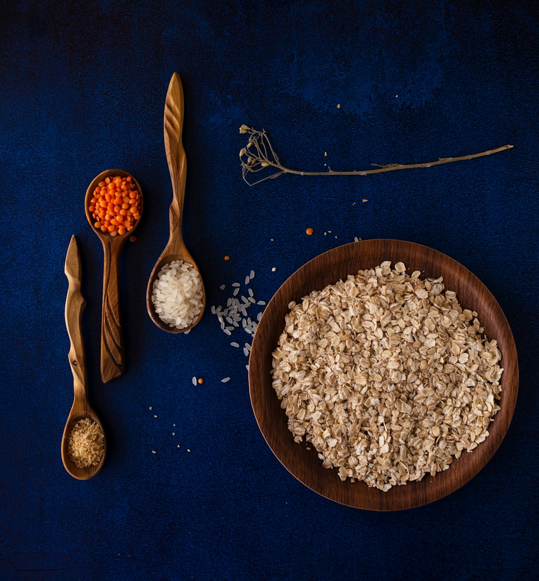 brown wooden spoon on blue textile