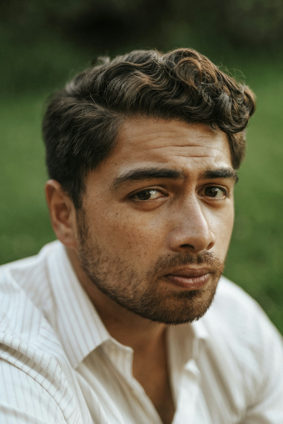 man in white and gray pinstripe dress shirt