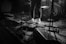 grayscale photo of man playing guitar