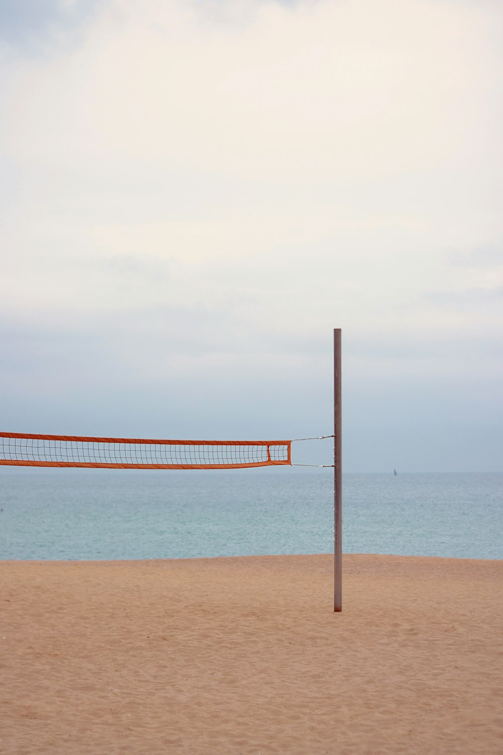 orange and white striped hammock on beach during daytime