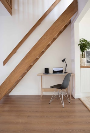 black and silver chair beside brown wooden table