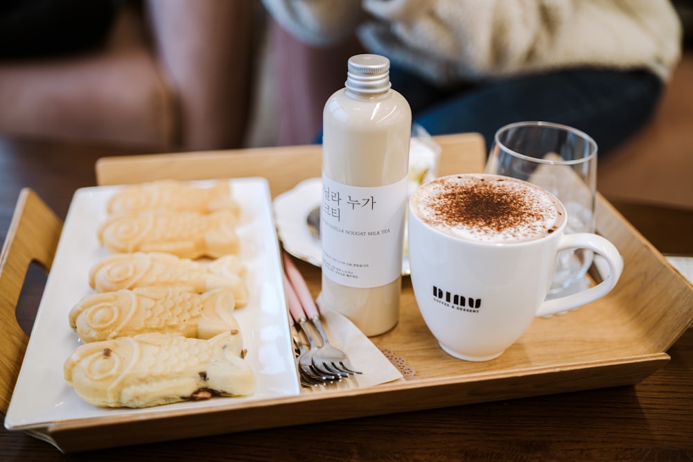 white ceramic mug on white ceramic plate