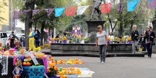 Community gathering in a town square with subtle decorations reflecting local traditions.