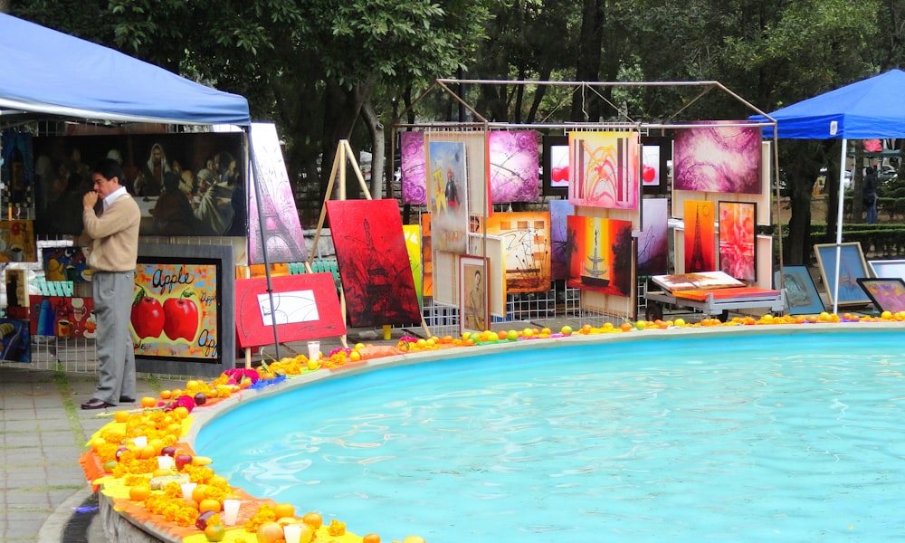 blue swimming pool with yellow and pink balloons