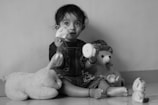 A child playing with toys during a therapy session.