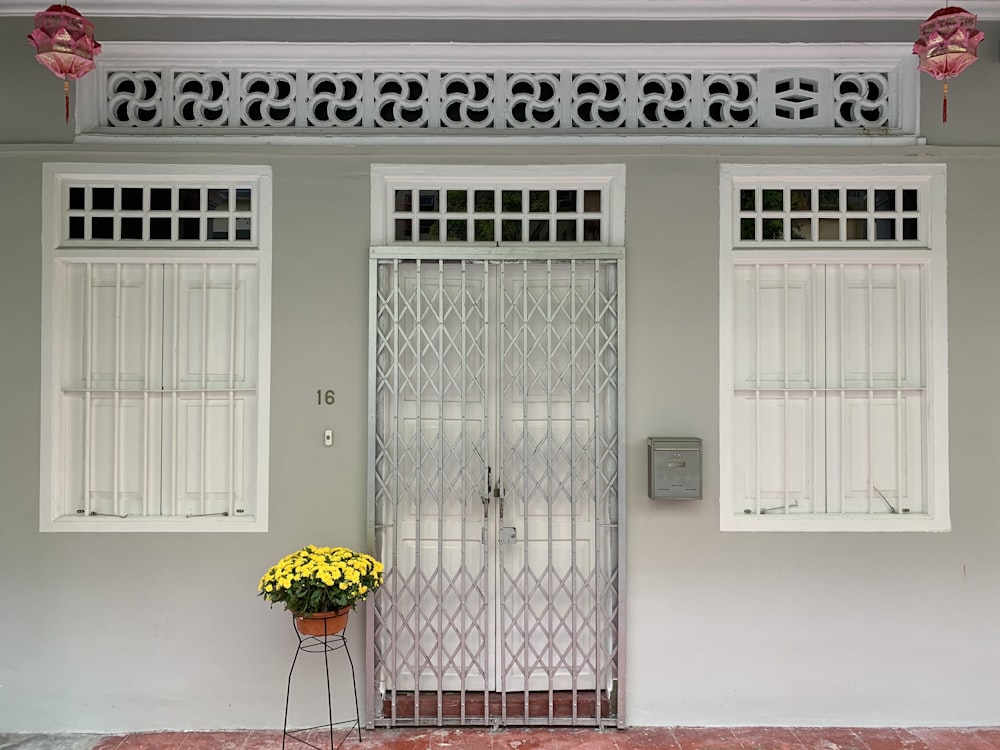 white wooden door with green and yellow umbrella