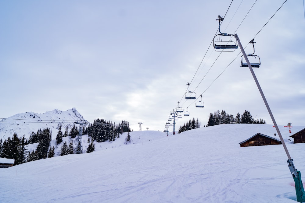 cable cars over snow covered mountain