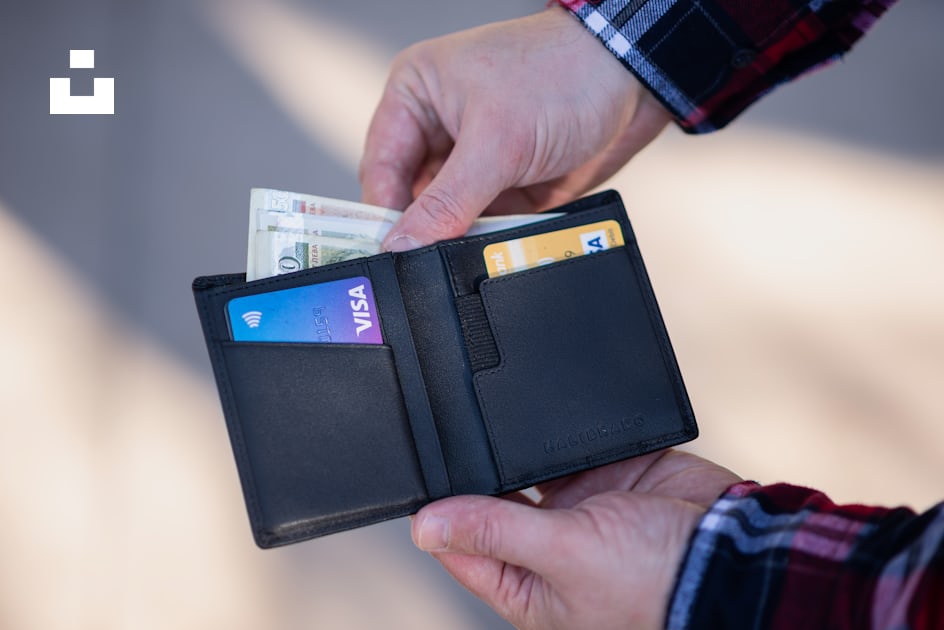 black leather bifold wallet on persons hand photo – Free Wallet Image on  Unsplash