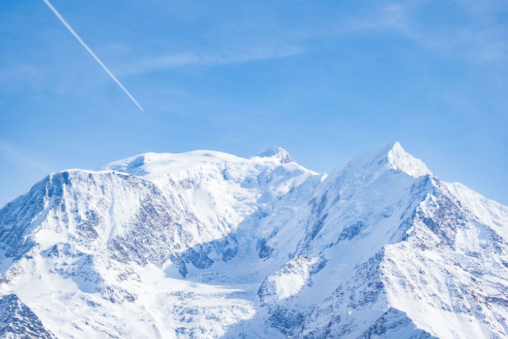 snow covered mountains under blue sky during daytime