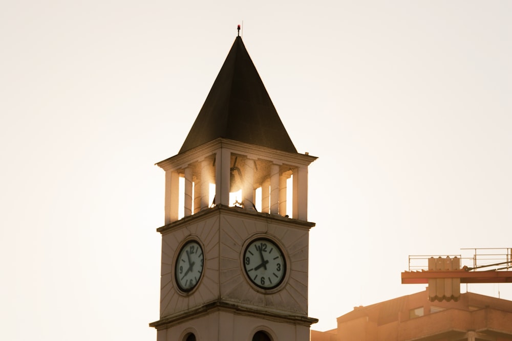 black and white analog clock at 10 00