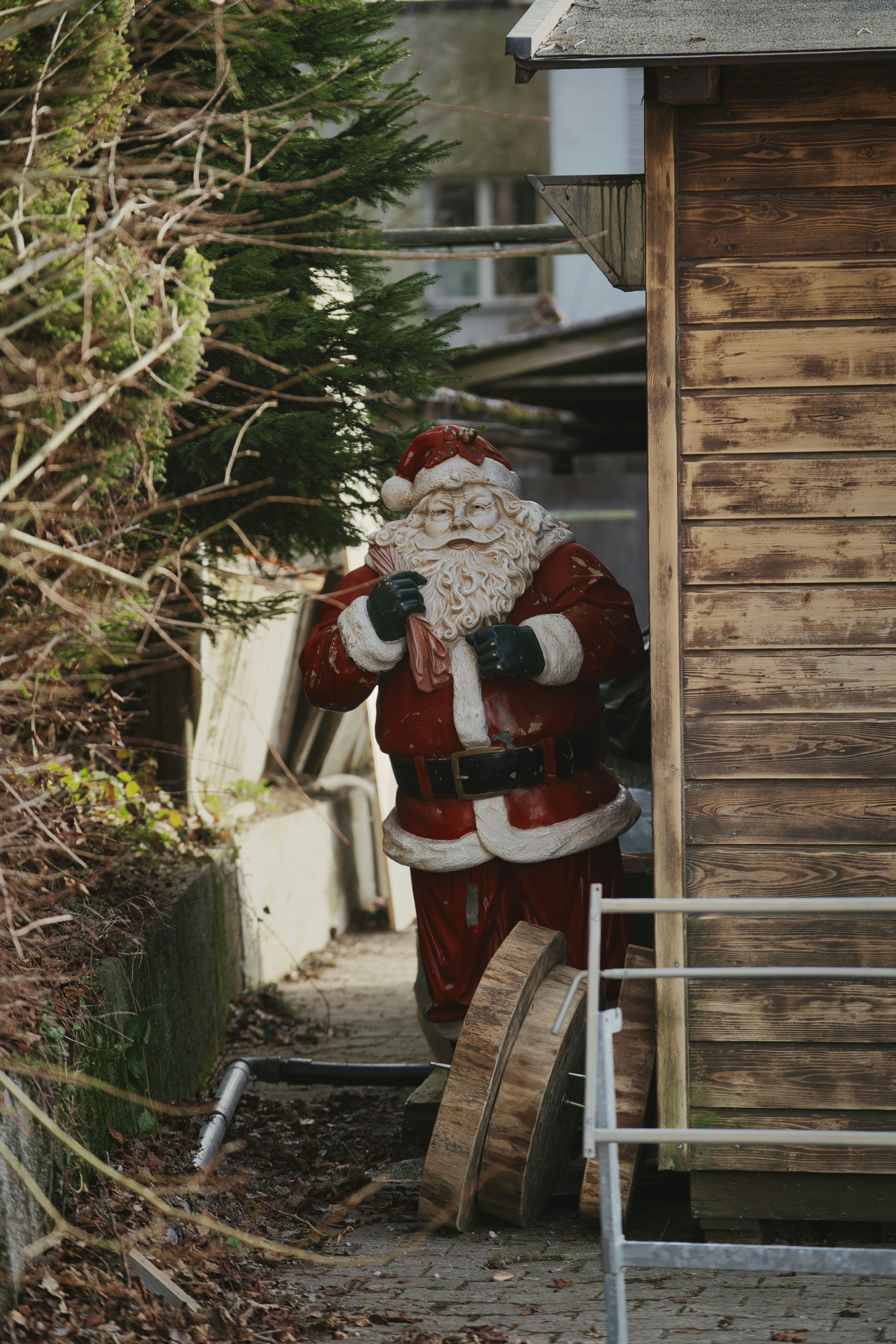 santa claus on brown wooden house