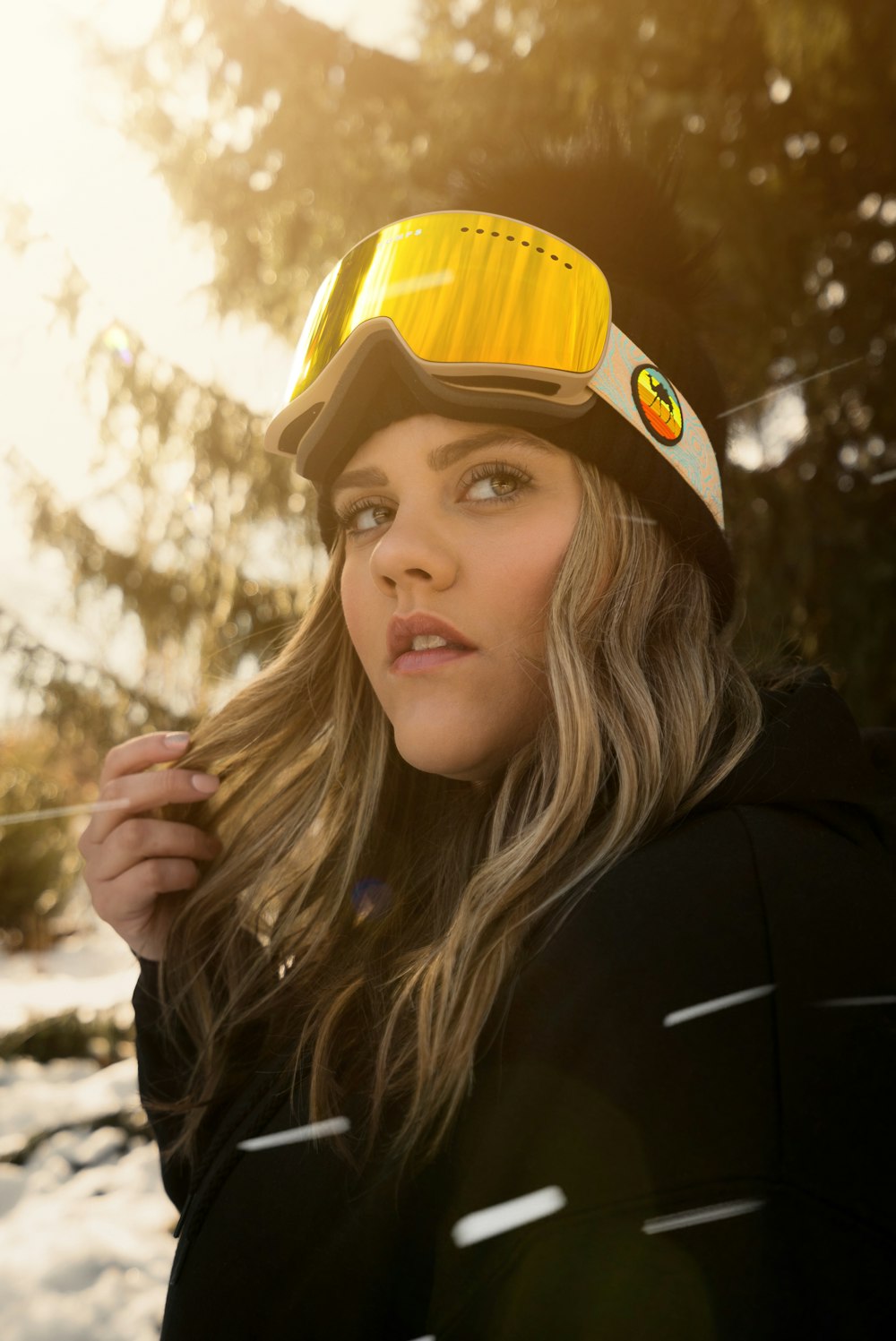 woman in black jacket wearing yellow hard hat