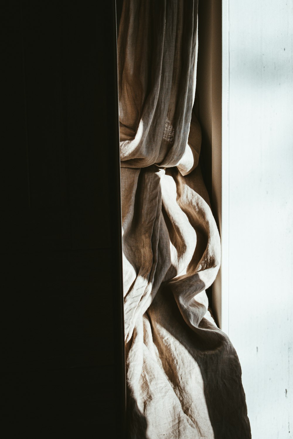 white textile on white table